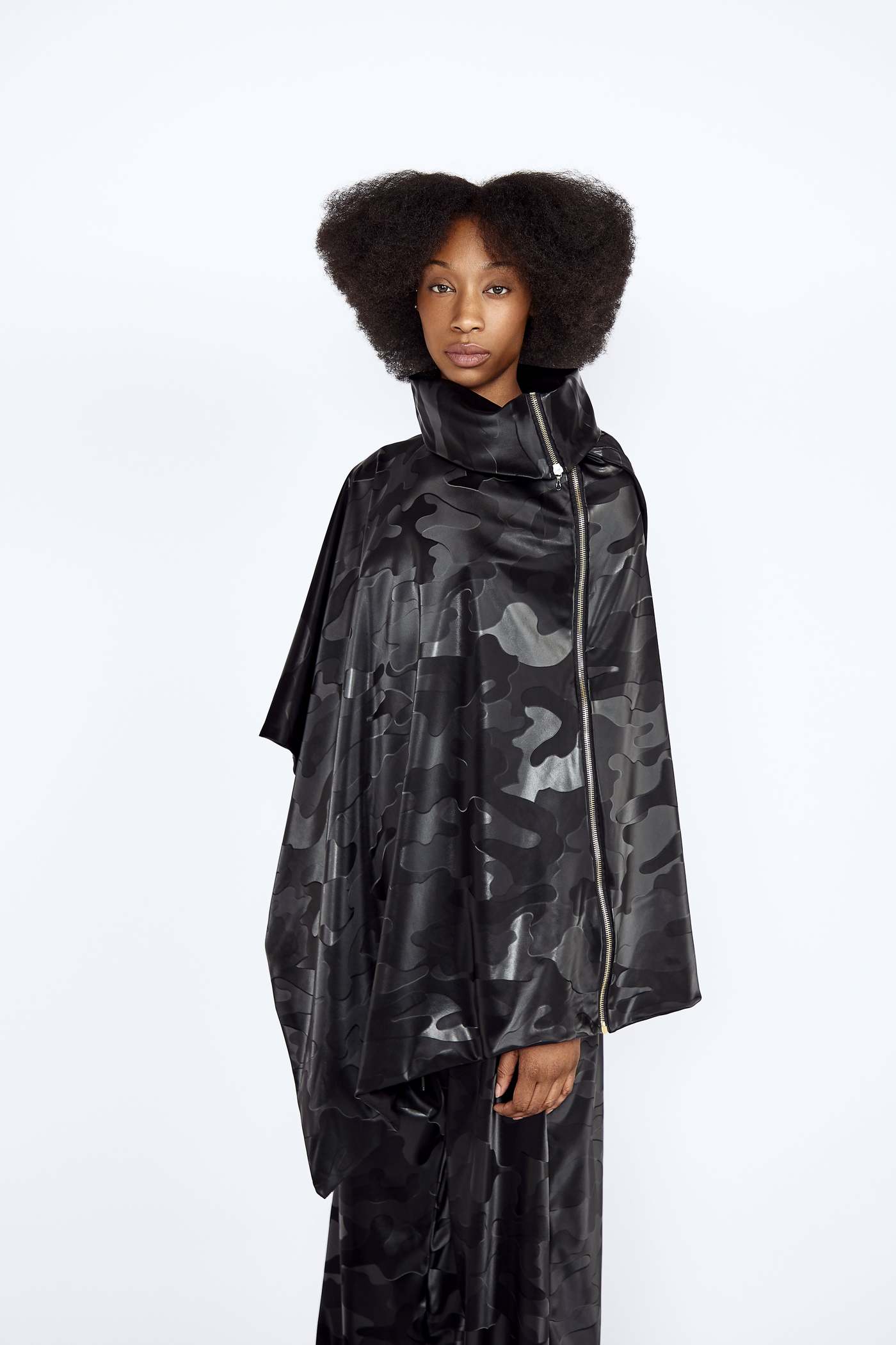 Black Camo Vegan Leather Poncho and Trousers Set blackcamo, boldstyle, hers, pineappleleather, poncho, ponchoset, sustainablefashion, trousersset, two pice set, veganleather, waterproof, womansweare Vidi Blak 