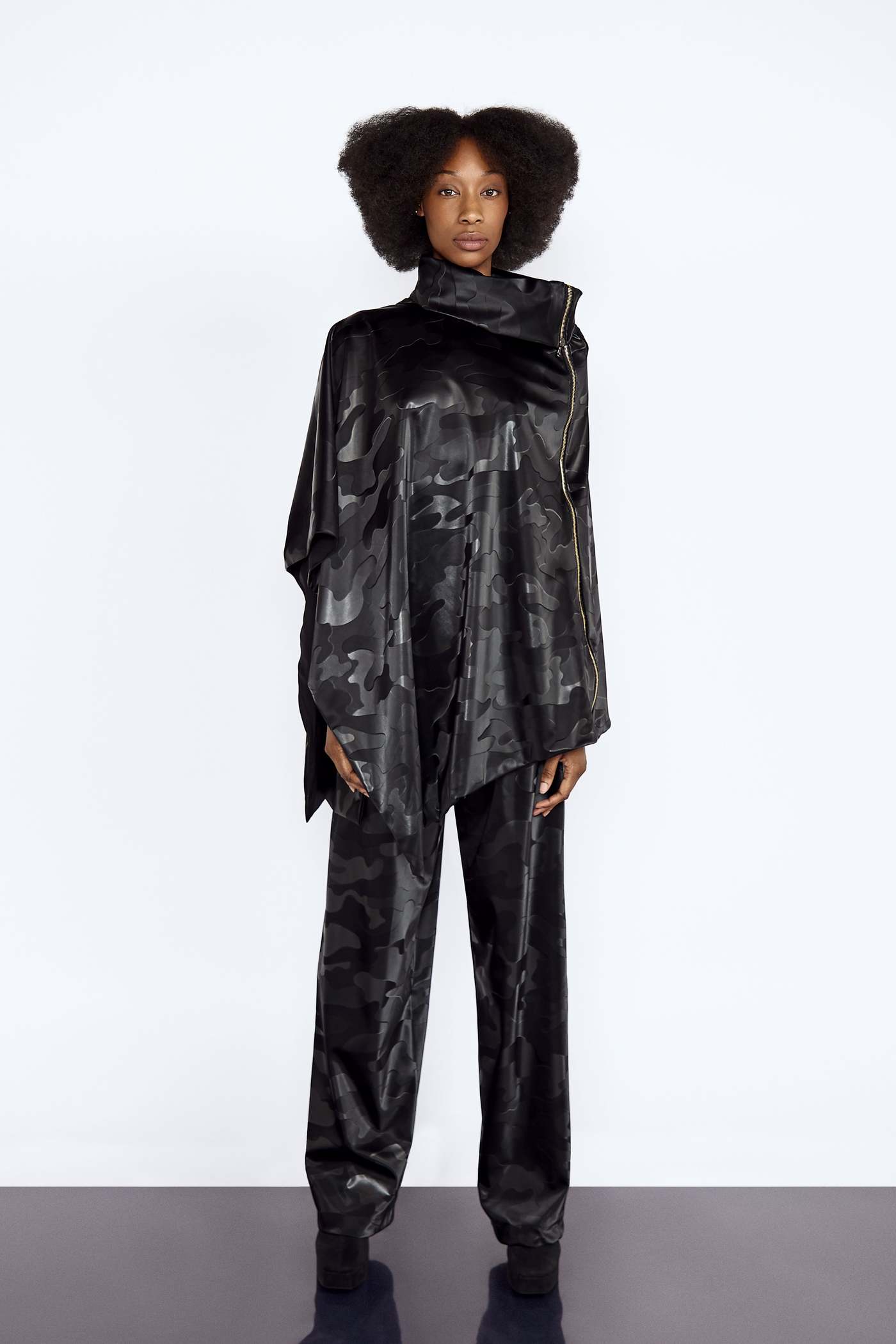 Black Camo Vegan Leather Poncho and Trousers Set blackcamo, boldstyle, hers, pineappleleather, poncho, ponchoset, sustainablefashion, trousersset, two pice set, veganleather, waterproof, womansweare Vidi Blak 