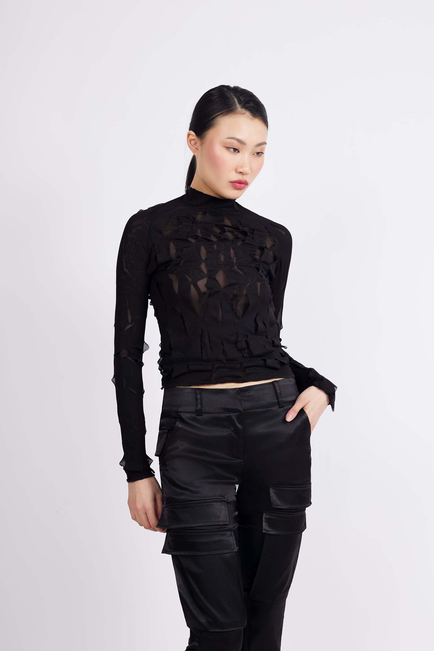 Black Slashed Mesh Top Black Mesh Top, Black Slashed Mesh Top, Captivating Design, Contemporary Style, Fabric Layering, HERS, Irregular Slashes, Men's Wear, Modern Fashion, Semi-Sheer Pattern, Sophisticated Artwork, Unique Top, unisex, Women's Fashion, womenfashion, womenstyle Vidi Blak 